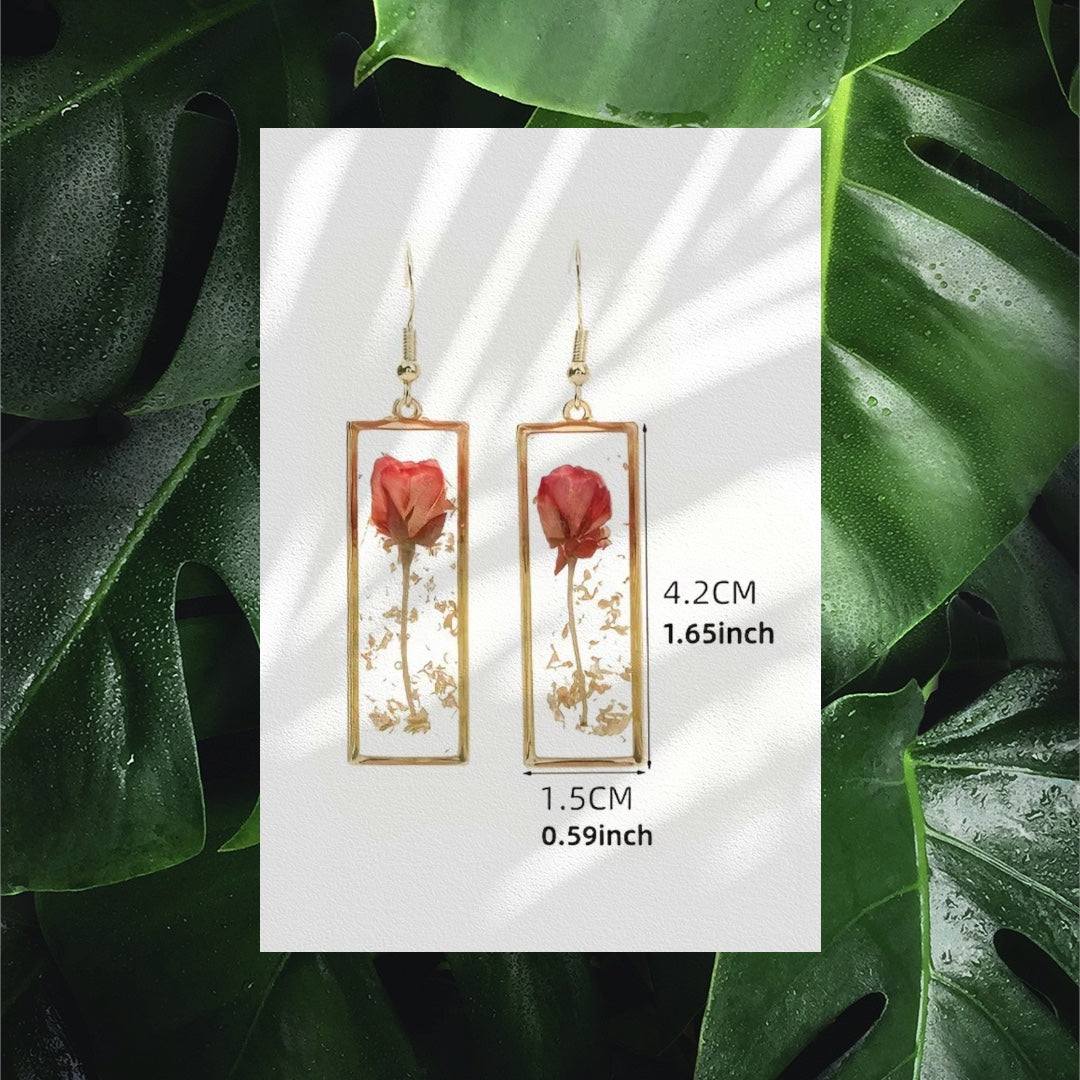 Handcrafted rectangle earrings with real dried rose petals encased in clear resin, minimalist floral design