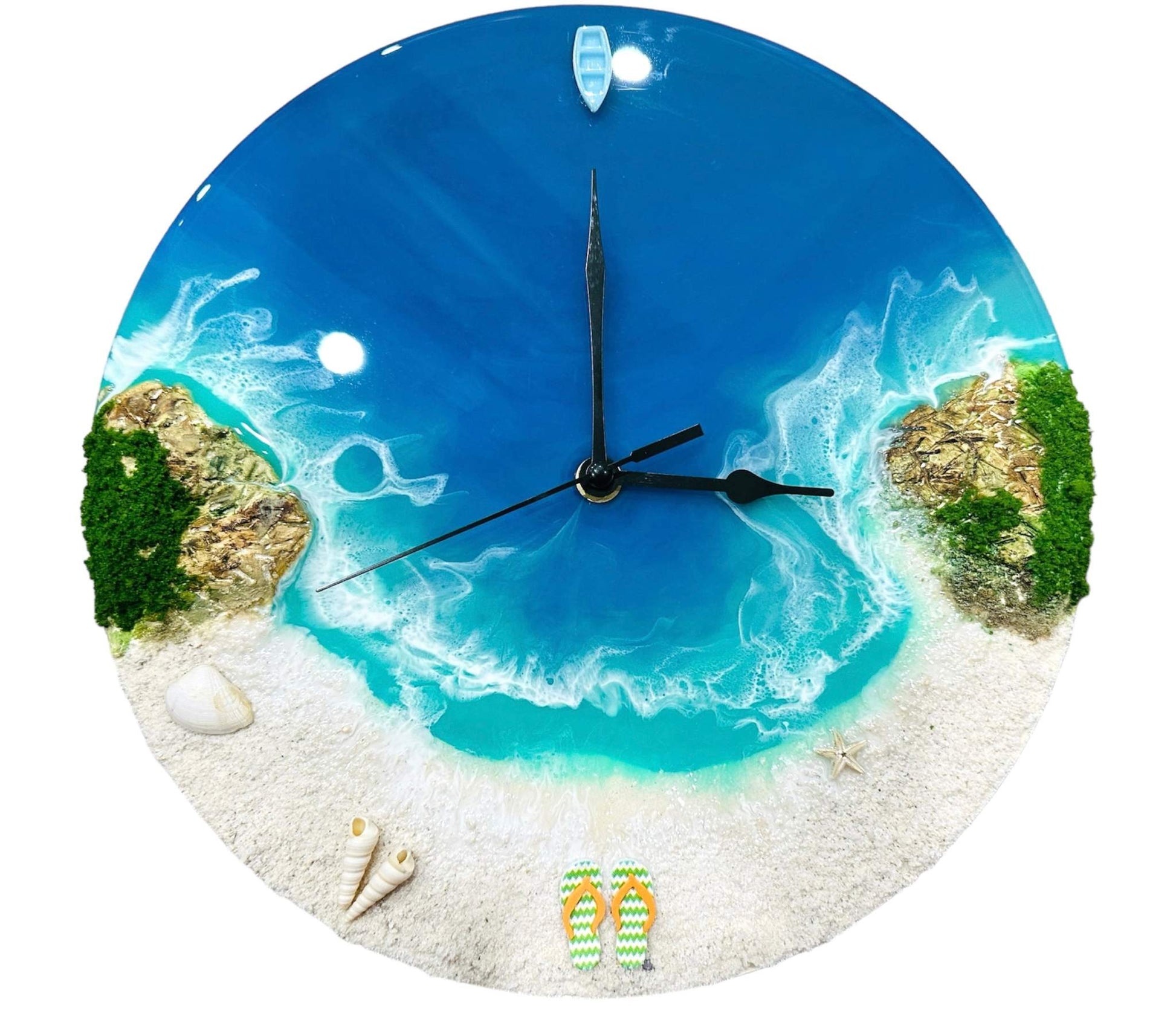 Round resin ocean wall clock with blue ocean waves, sandy beach, seashells, starfish, miniature boat, and rocky islands design