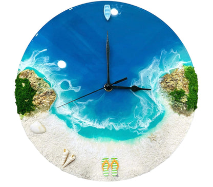 Round resin ocean wall clock with blue ocean waves, sandy beach, seashells, starfish, miniature boat, and rocky islands design