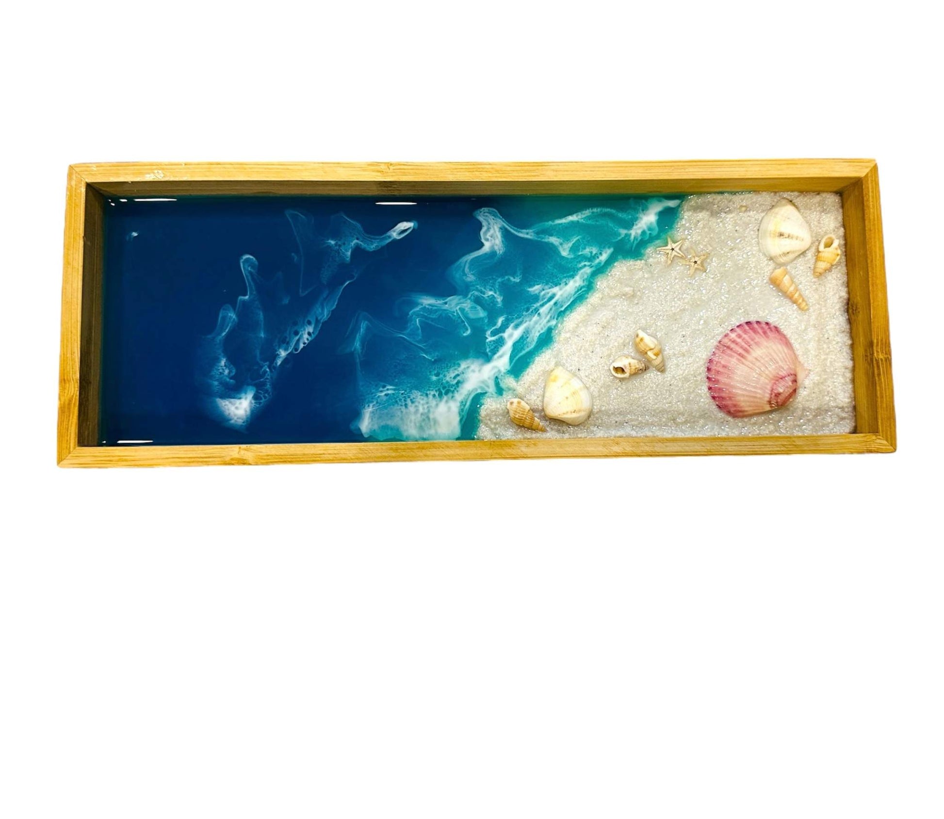 Wooden decorative tray with ocean wave art, seashells, starfish, and natural wood frame