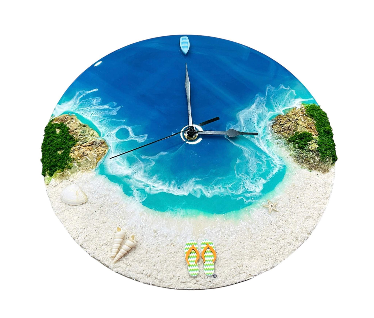 Round resin ocean wall clock depicting beach, turquoise waves, seashells, starfish, and miniature boat with natural sand and moss details.