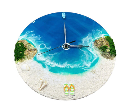 Round resin ocean wall clock depicting beach, turquoise waves, seashells, starfish, and miniature boat with natural sand and moss details.