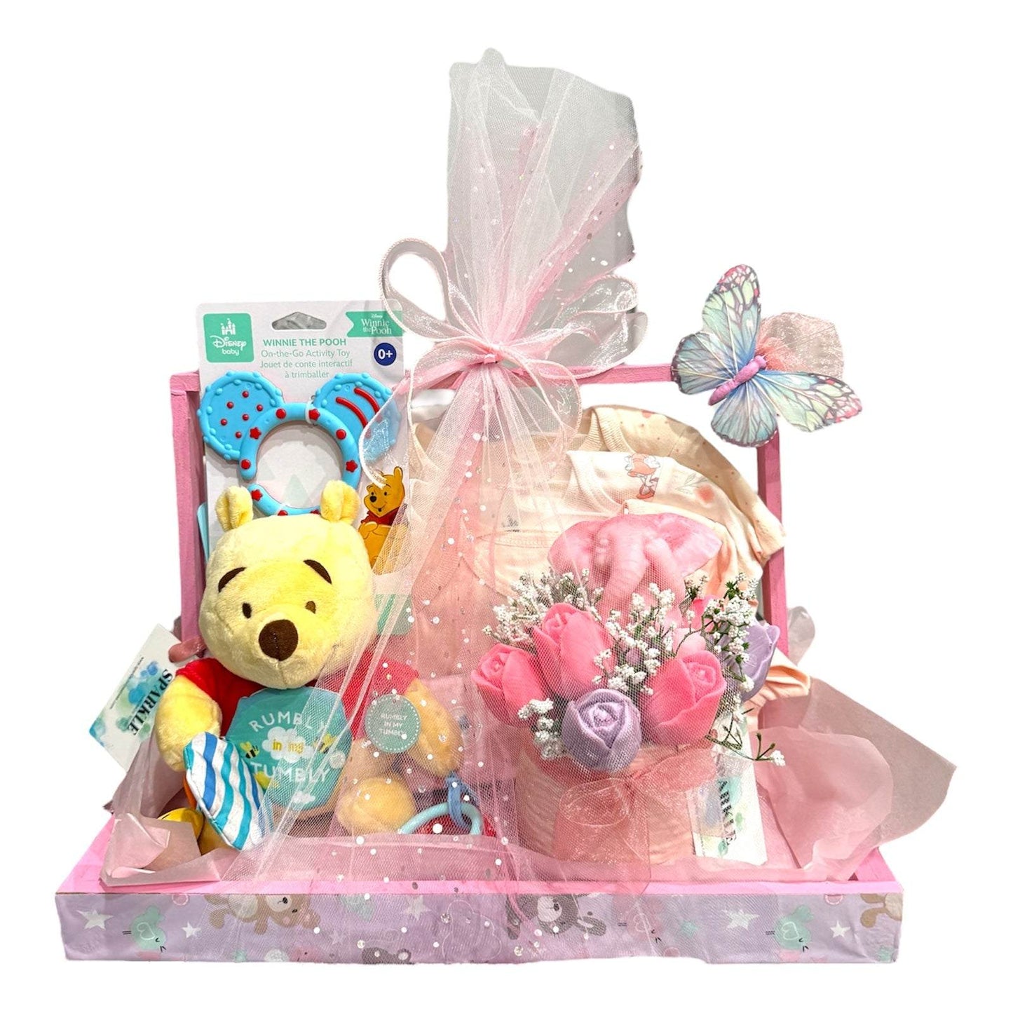 Customizable gift basket for mom with baby clothes, blanket, shea soap, candle, bouquet, and plush toy wrapped in pink packaging