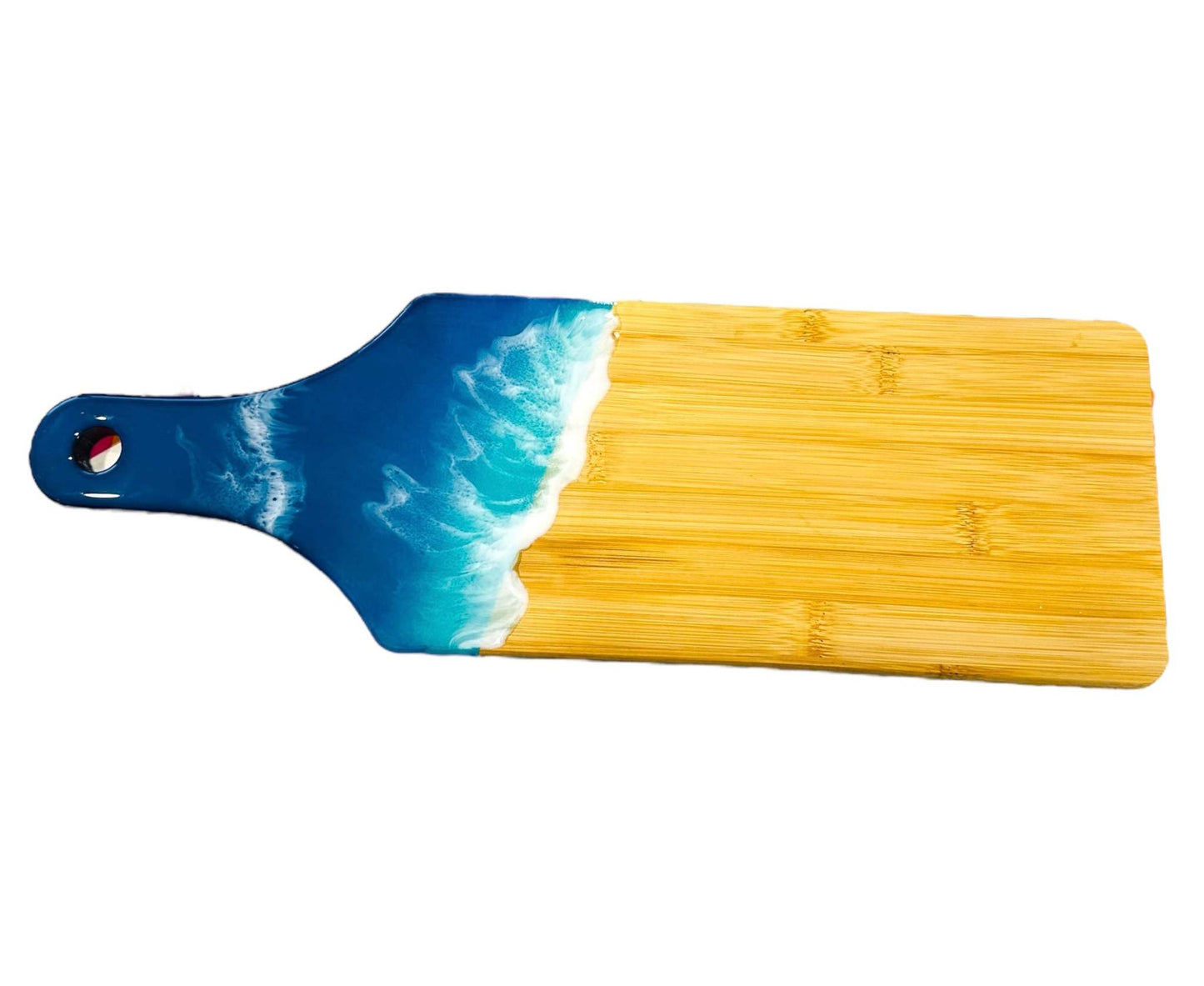 Ocean wave resin cheese board with handcrafted blue and white ocean wave design on a bamboo serving board