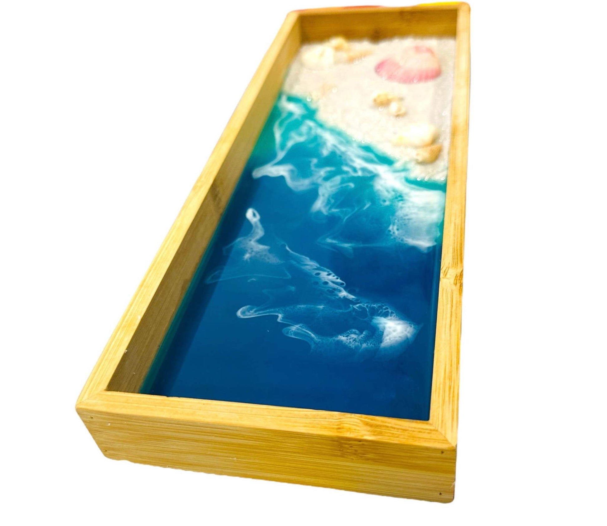 Wooden decorative tray with ocean wave resin art and seashell accents in a natural wood frame