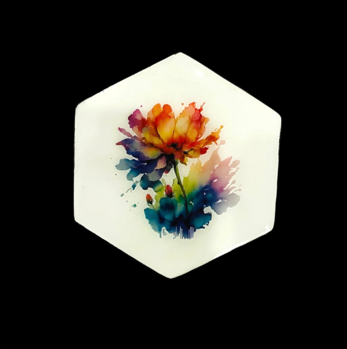 Hexagonal watercolor flower resin coaster with vibrant multicolor floral design on a clear background