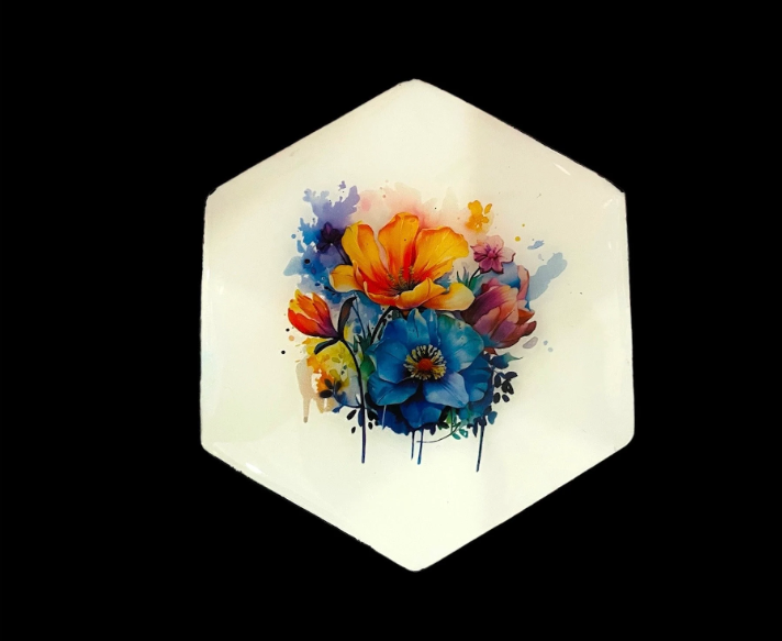 Hexagonal watercolor flower resin coaster with vibrant orange, blue, and pink floral design on white background