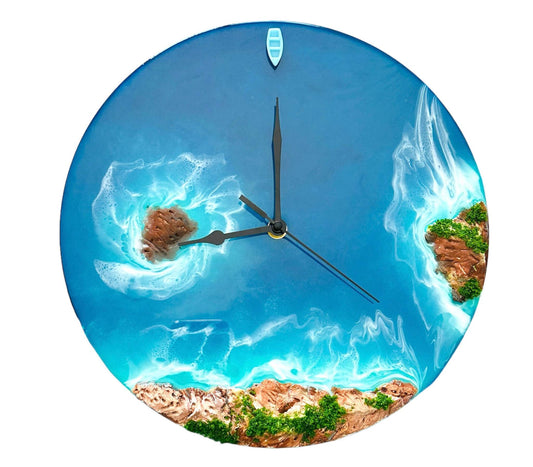 Round resin ocean wall clock featuring island, ocean waves, beach, rocks, and a miniature boat with turquoise resin waves.