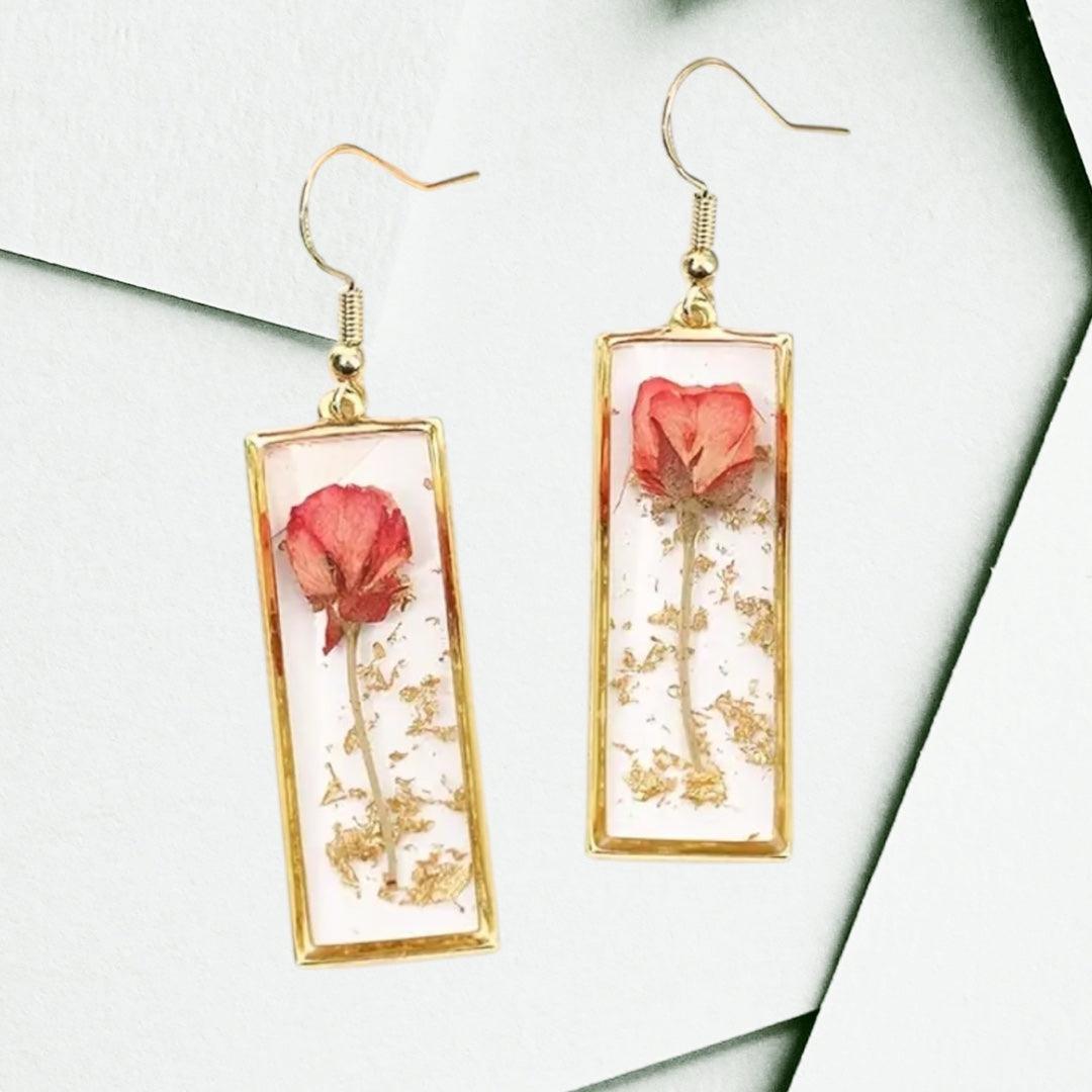 Handcrafted rectangle earrings with real dried rose petals encased in clear resin and gold-tone frames