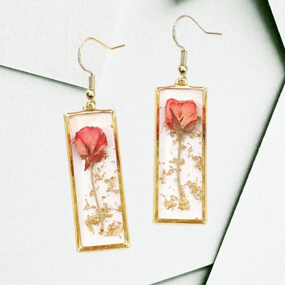 Handcrafted rectangle earrings with real dried rose petals encased in clear resin and gold-tone frames