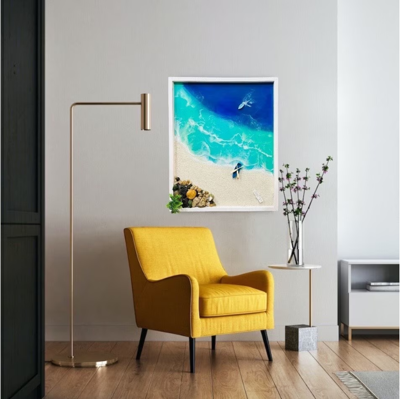 3D ocean wall art featuring resin waves and beach scene in modern living room with yellow armchair