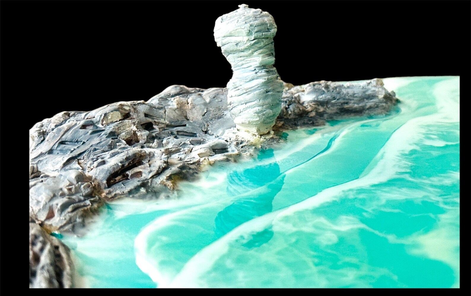 Close-up of handcrafted coastal landscapes art featuring Flowerpot Island rock formation and turquoise ocean waves in glossy resin finish